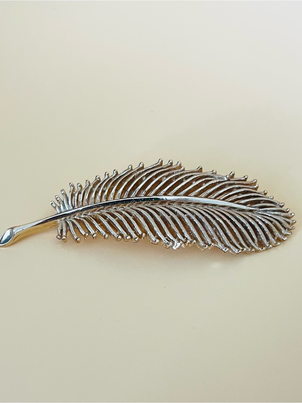 Large Gold tone feather brooch